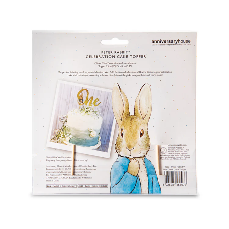 Back of packet showing info and a delightfully cute Peter Rabbit drawing, also shows an example of the topper used on a buttercream Ombre Blue & White cake decorated with white flowers.